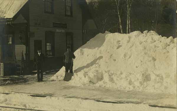 Clearing snow off the Bradford station platform