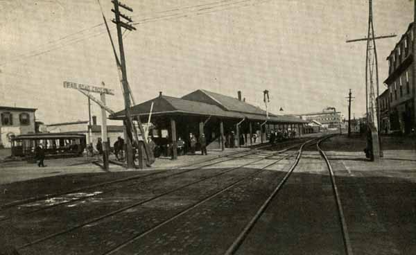 Boston & Maine Station, Woodbury Shoe Co. in the distance, Derry, New Hampshire